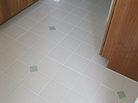 Ceramic Tiled Bathroom Floor w/ a Simple Pattern