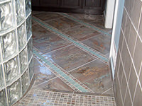 Bathroom with Glass Wall and Floor Tiles